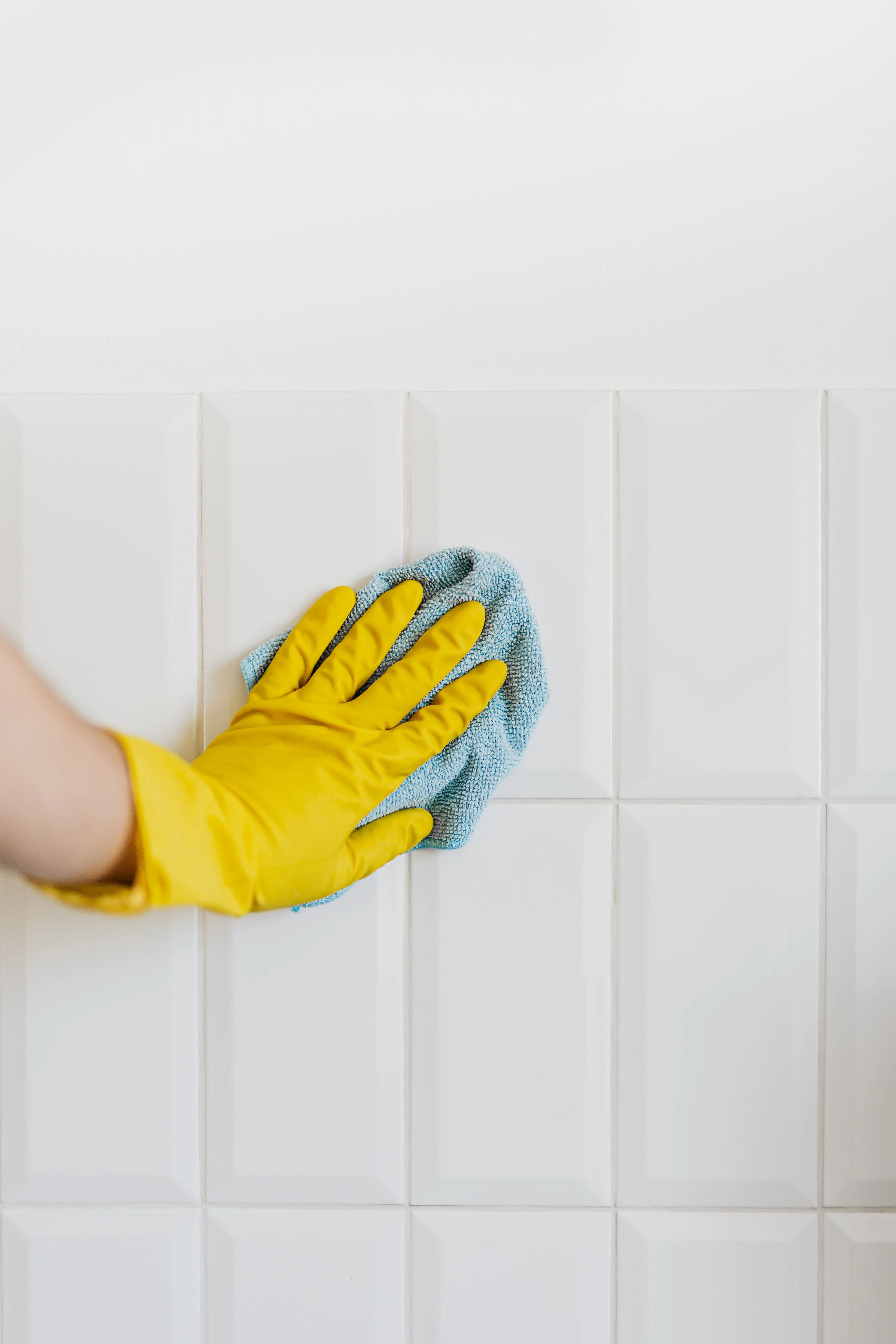 Technician cleaning a tiled wall with a sponge in Soquel, CA